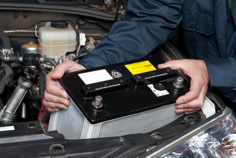 Auto Electrician replacing Car Battery